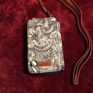 Wristlet with detachable shoulder strap.